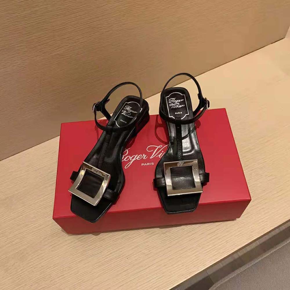 Close-up of polished metal buckle on Roger Vivier Bikiviv’ sandals