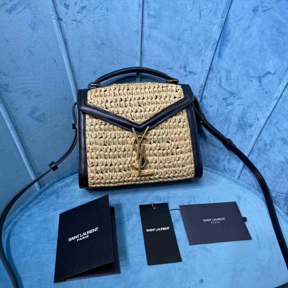Close-up of gold YSL logo and raffia texture on Cassandra Mini bag