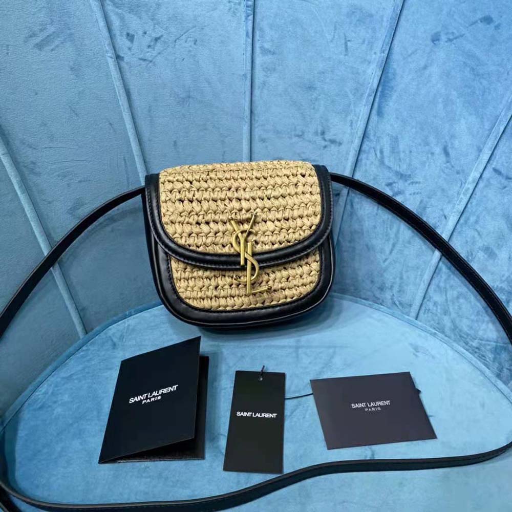 Close-up of gold YSL logo hardware on Kaia Small Satchel black leather flap