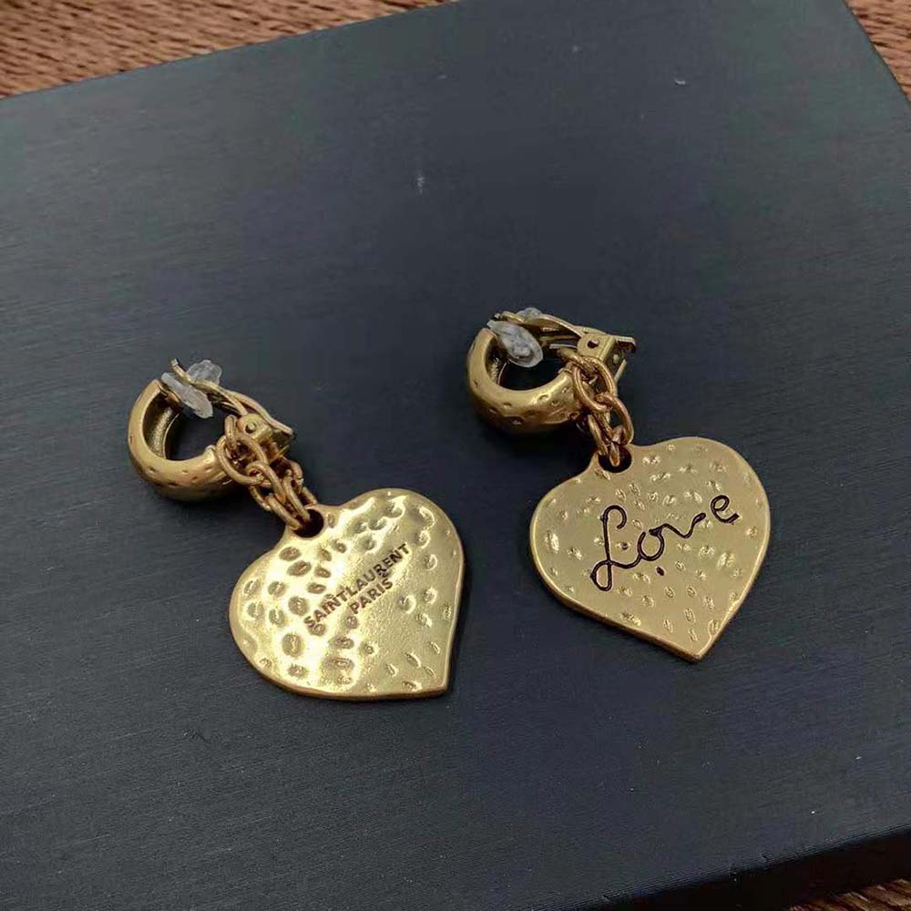 Side angle showing gold post back closure of Saint Laurent earrings
