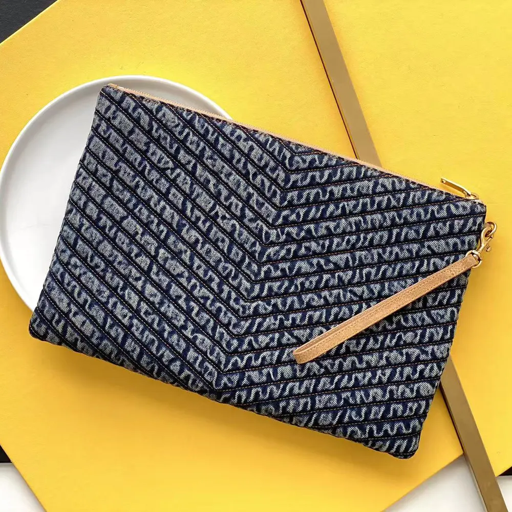 Side angle showing zip closure and suede trim on tablet pouch