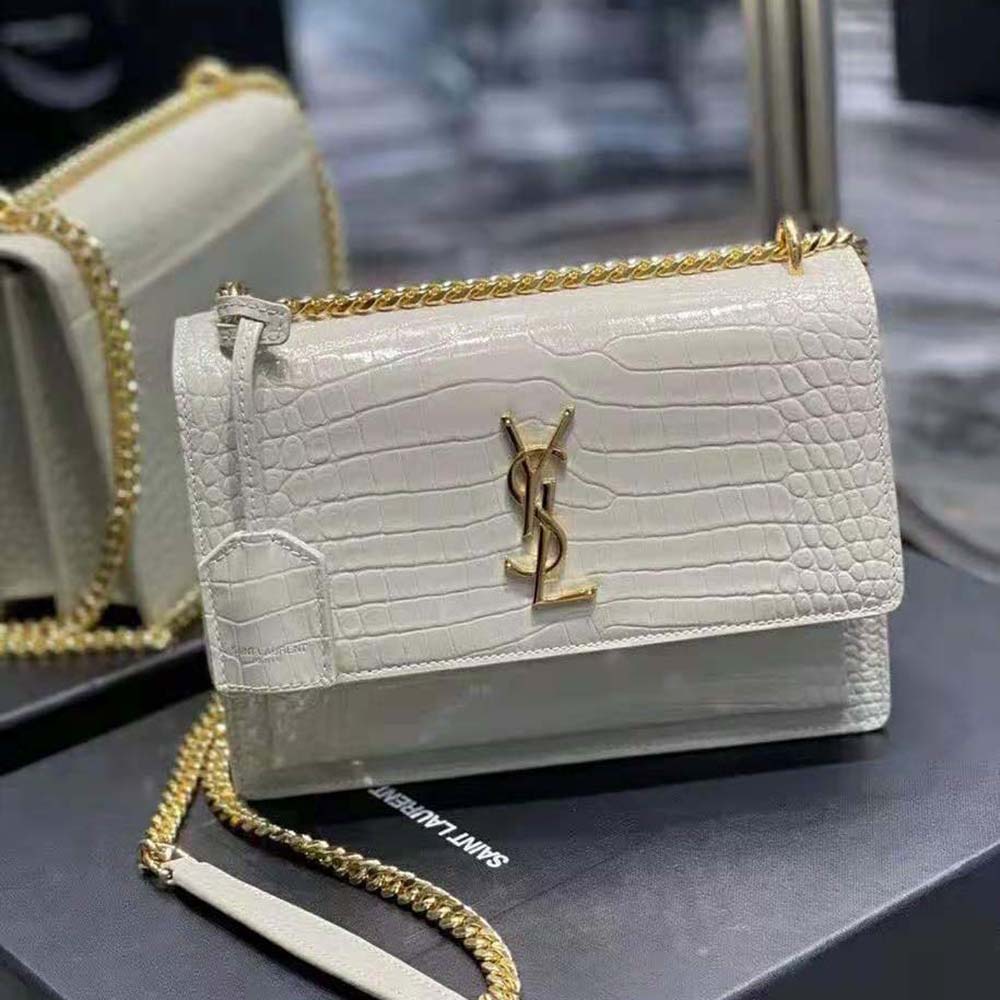 Close-up of gold YSL logo hardware on Saint Laurent YSL Women Sunset Medium bag
