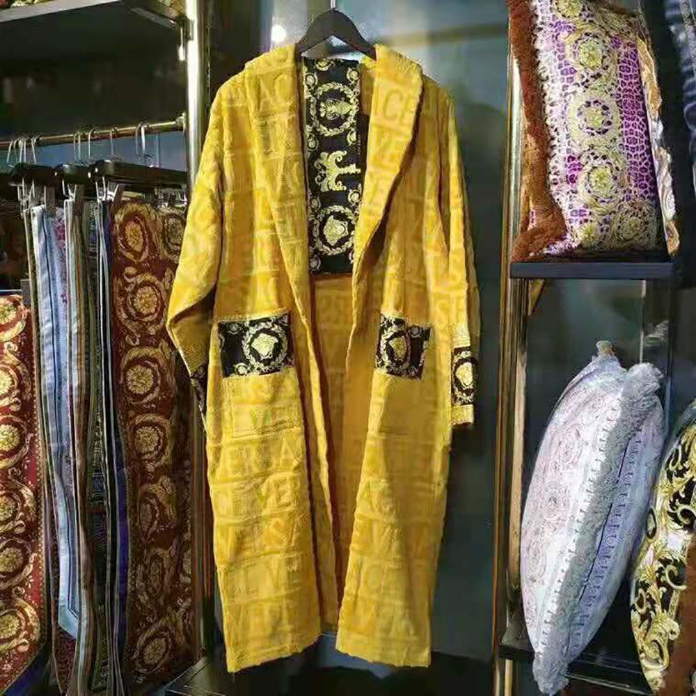 Close-up of gold Baroque medallion on Versace Women I Baroque Bathrobe-Yellow