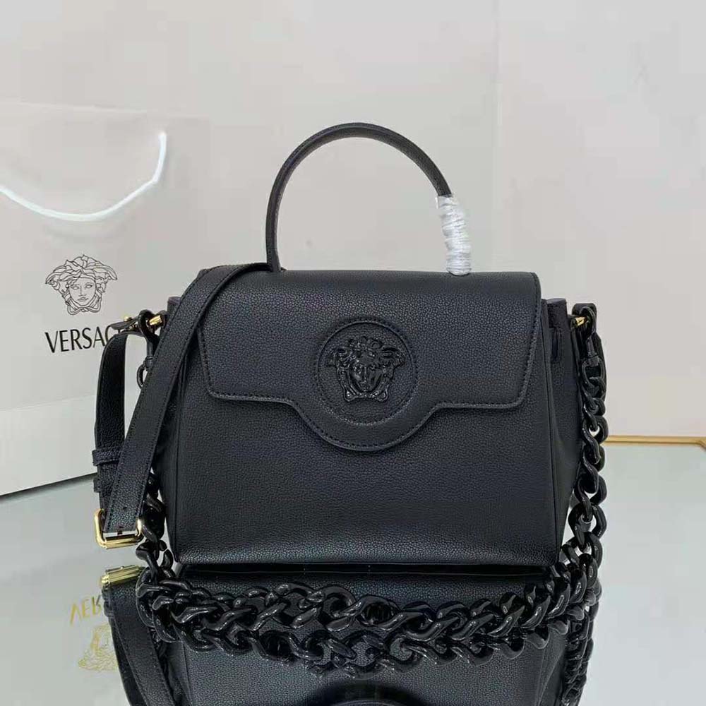 Close-up of gold Medusa hardware on Versace Women La Medusa Medium Handbag
