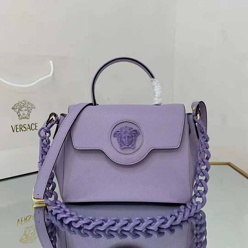 Close-up of gold Medusa emblem on Versace Women La Medusa Medium Handbag