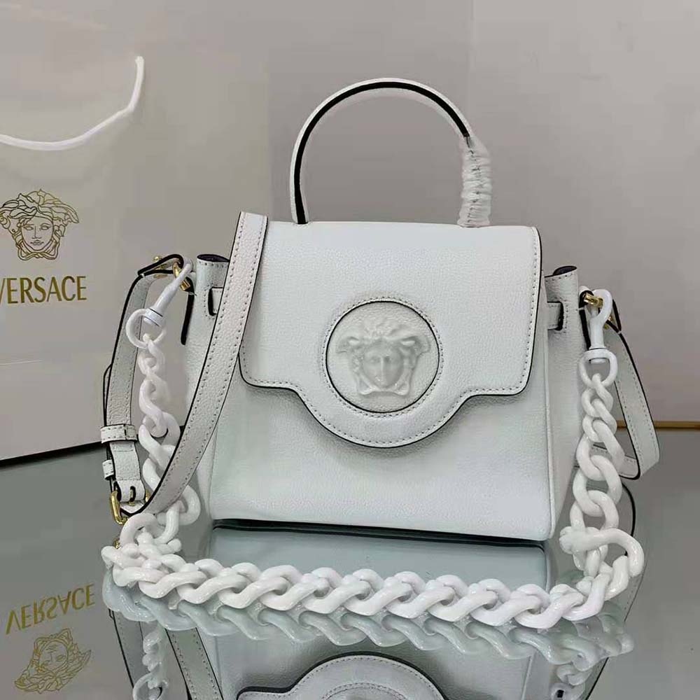 Close-up of gold Medusa hardware on Versace Women La Medusa Small Handbag