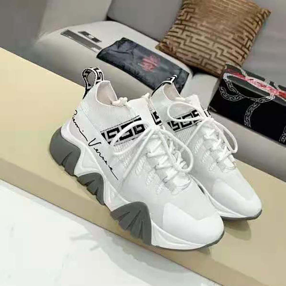 Close-up of Medusa emblem on Versace Women Squalo Knit Sneakers-White