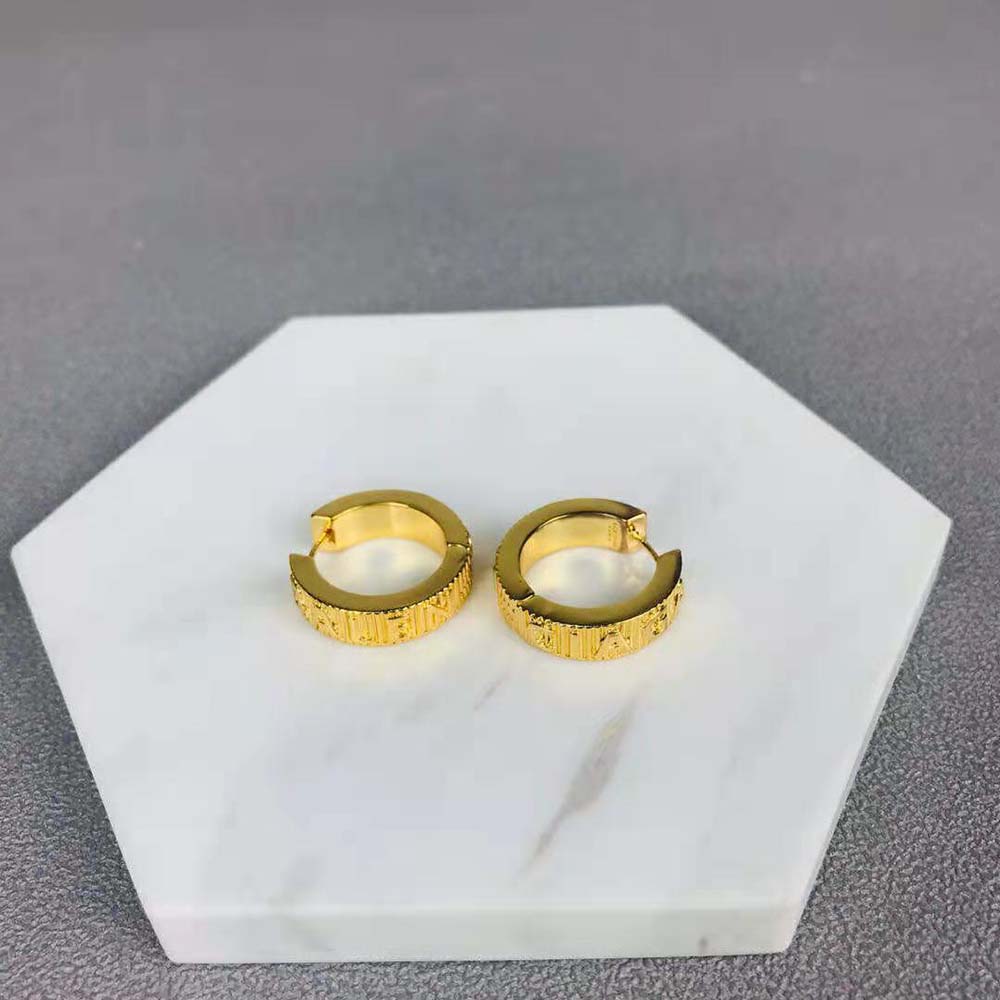 Close-up detail of striped pattern on Balenciaga Women Force Earrings