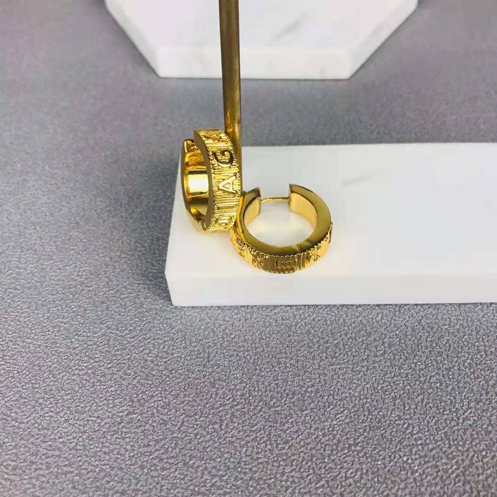 Side angle showing post closure of Balenciaga Women Force Striped Earrings