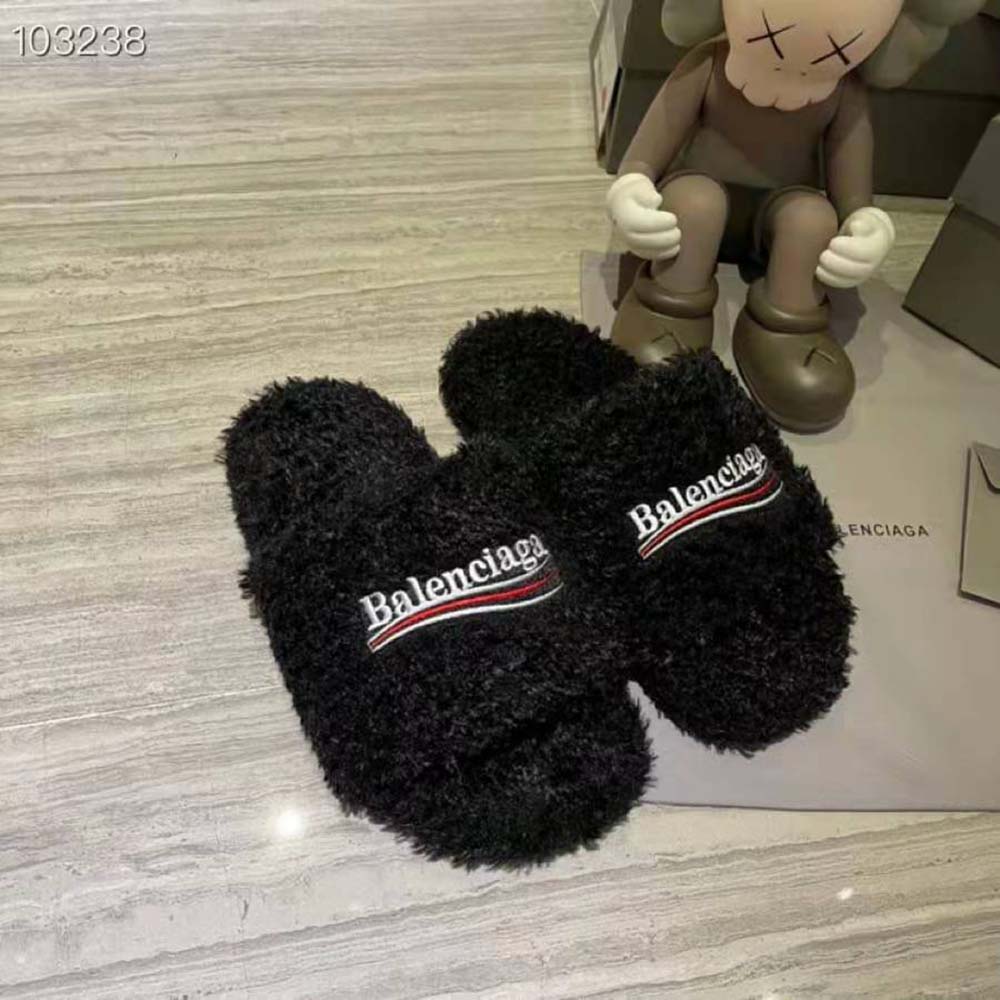 Top view showing plush black shearling and slide silhouette of Balenciaga sandal