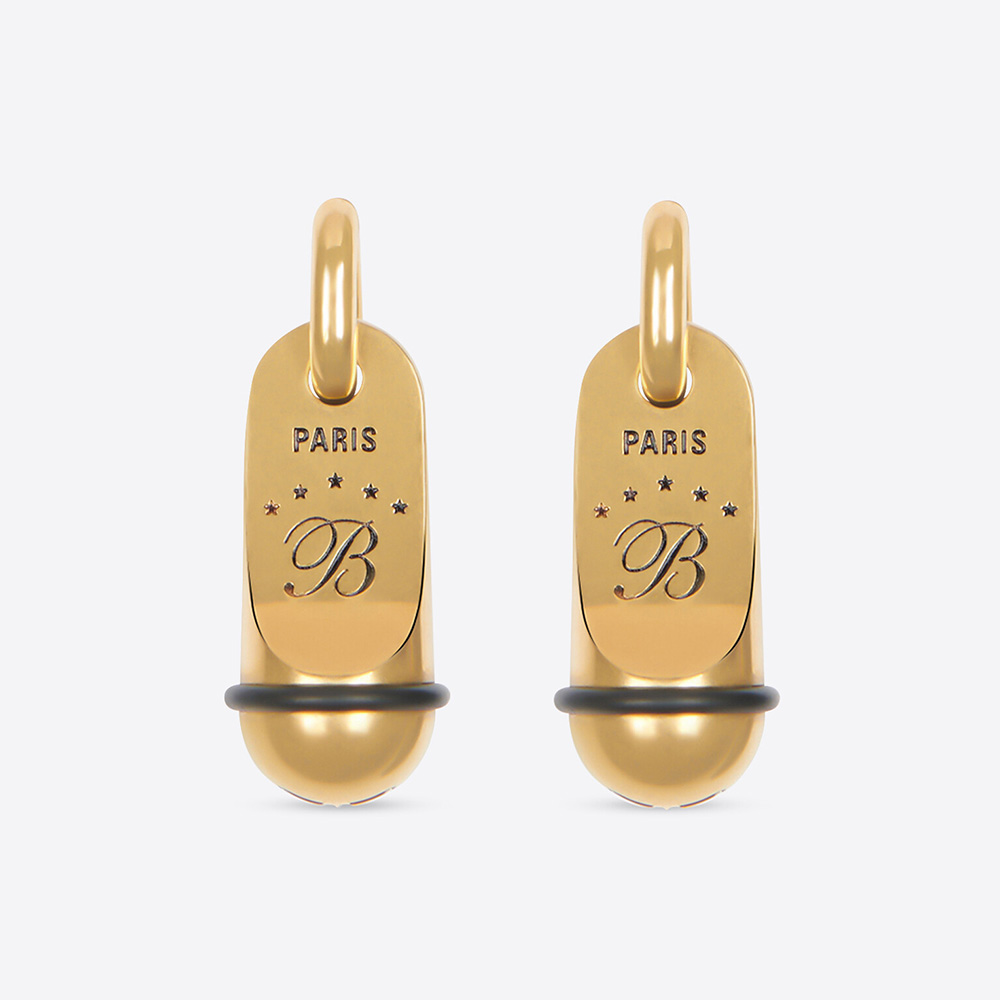 Close-up of Balenciaga Women Hotel Earrings showcasing gold aluminium detail
