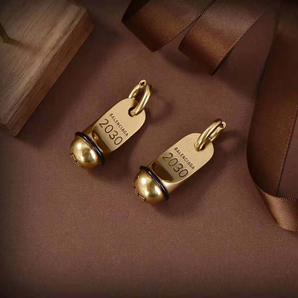 Side view of Balenciaga Women Hotel Earrings highlighting signature curves