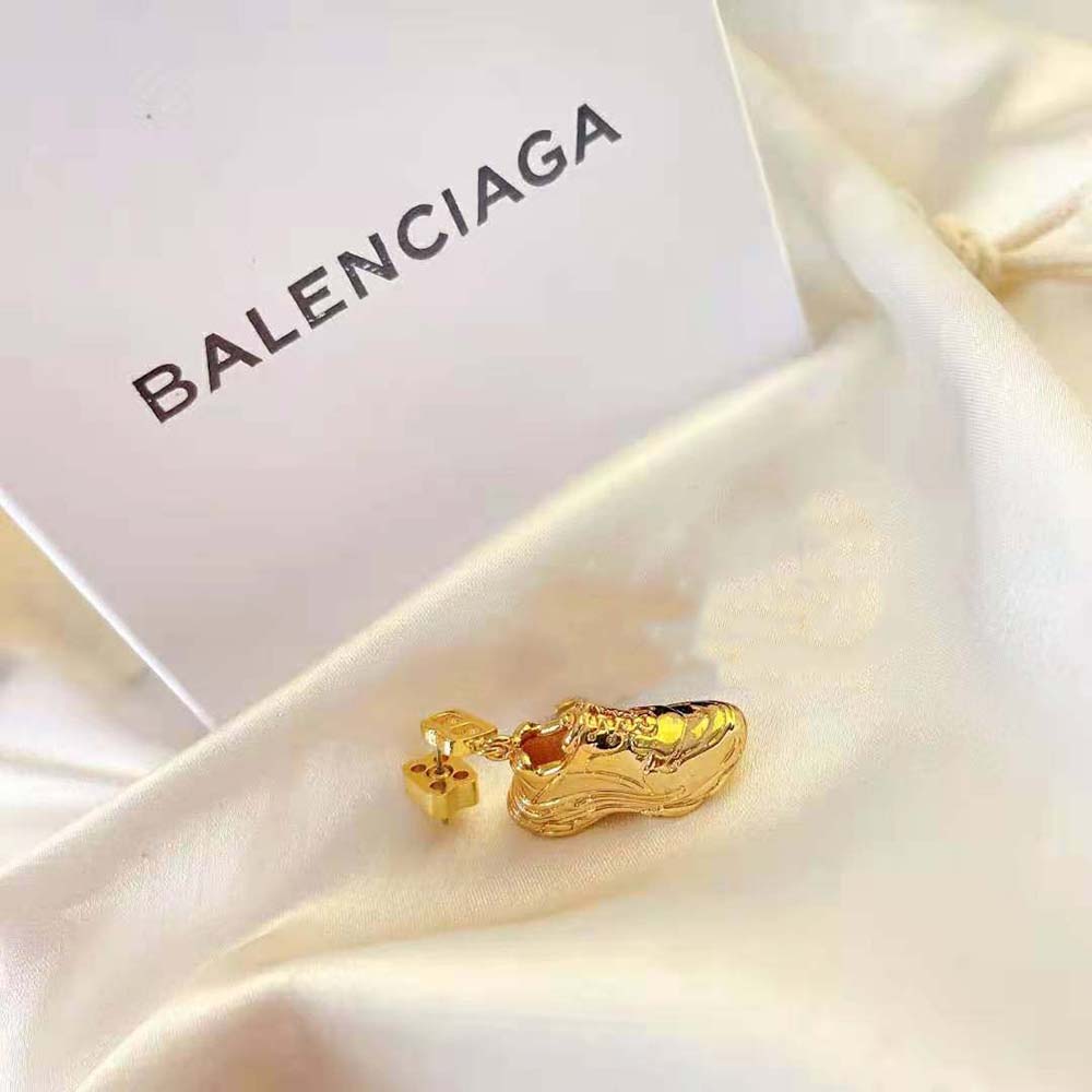 Balenciaga Women Mini Triple S Earring detail highlighting gold and bronze finish