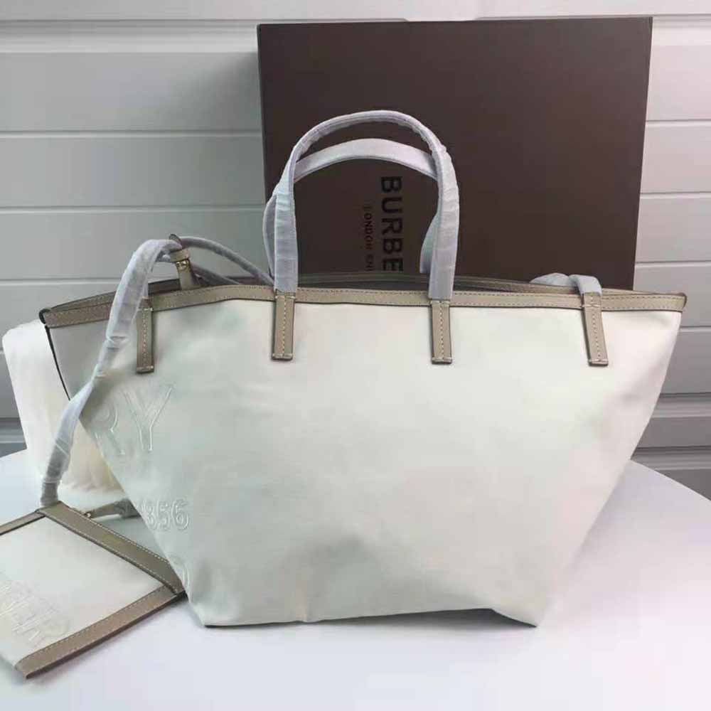 Side angle showing zip closure on Burberry Women Mini Horseferry Tote