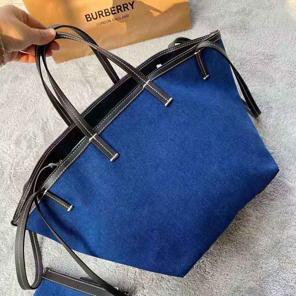 Side angle showing zip closure of Burberry Women Mini Logo Graphic Denim Beach Tote