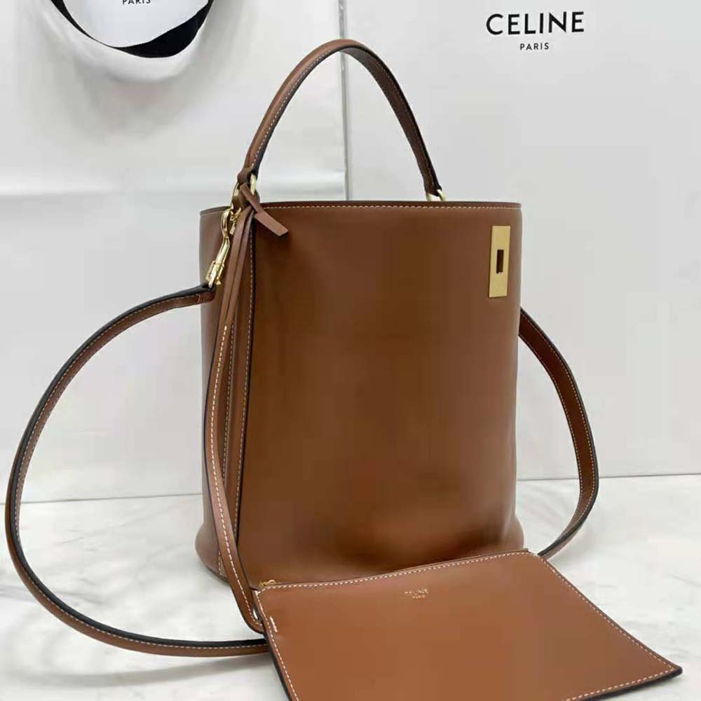 Side angle showing silhouette and leather texture of Celine Women Bucket 16 Bag