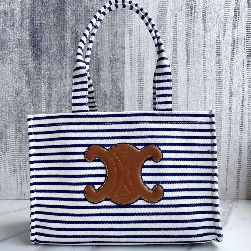 Close-up of striped textile and gold hardware on Celine Women Large Cabas Thais