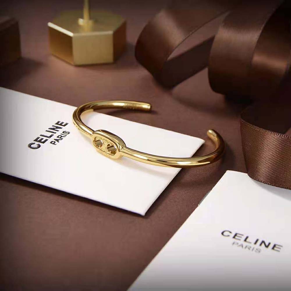 Side angle showing open cuff design of Celine Women thin cuff