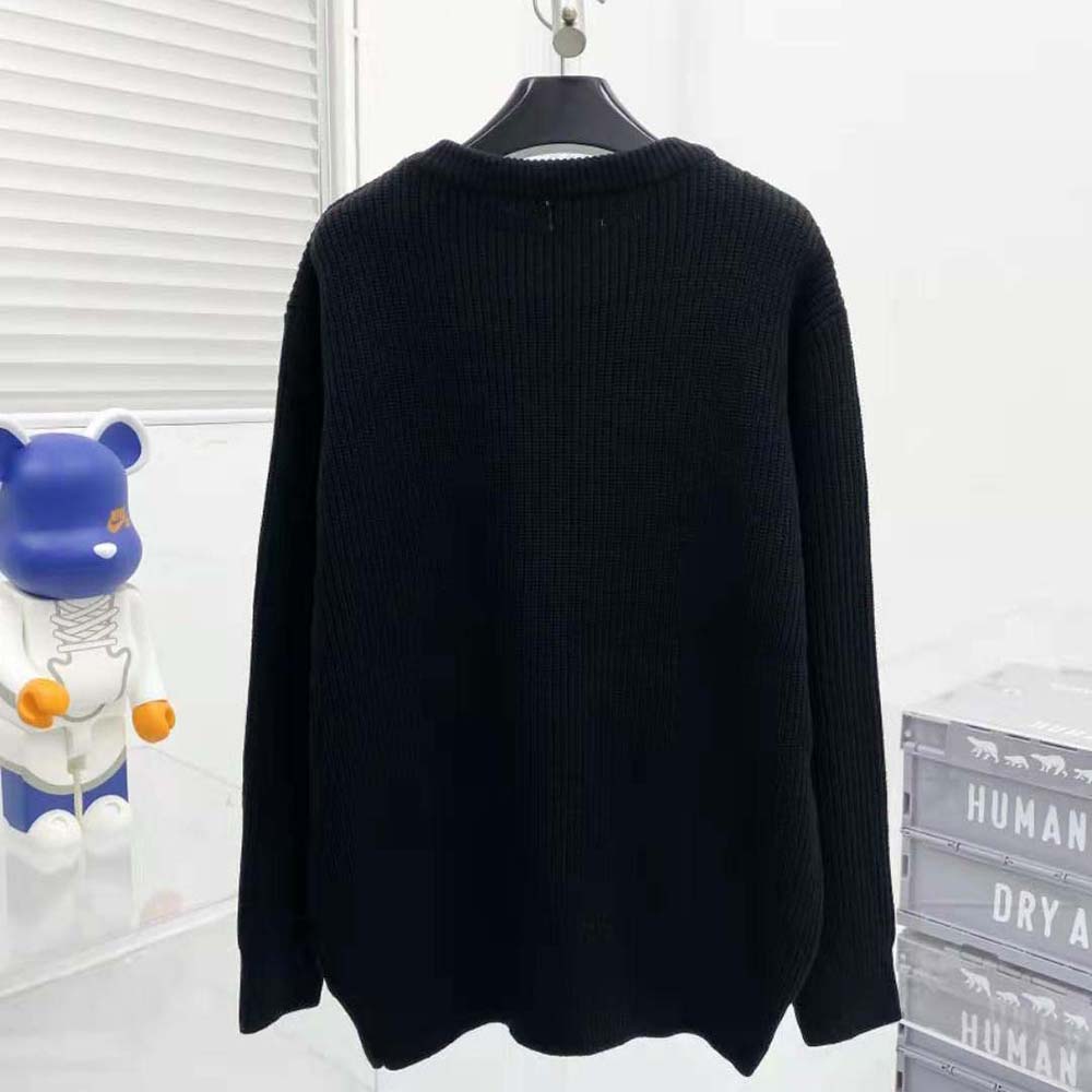 Side angle showing relaxed silhouette of Celine Women Oversized Celine Sweater