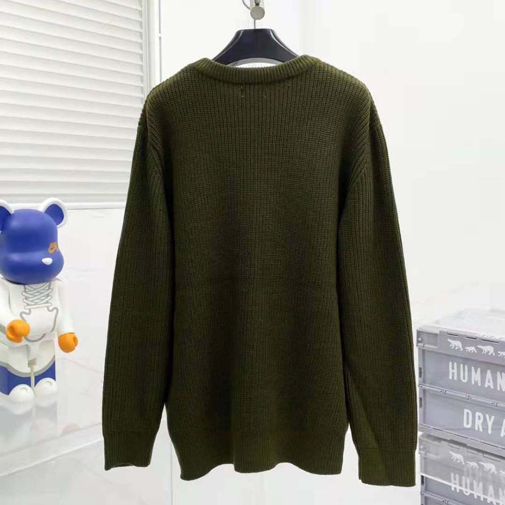 Side angle showing oversized fit of Celine Women Oversized Celine Sweater