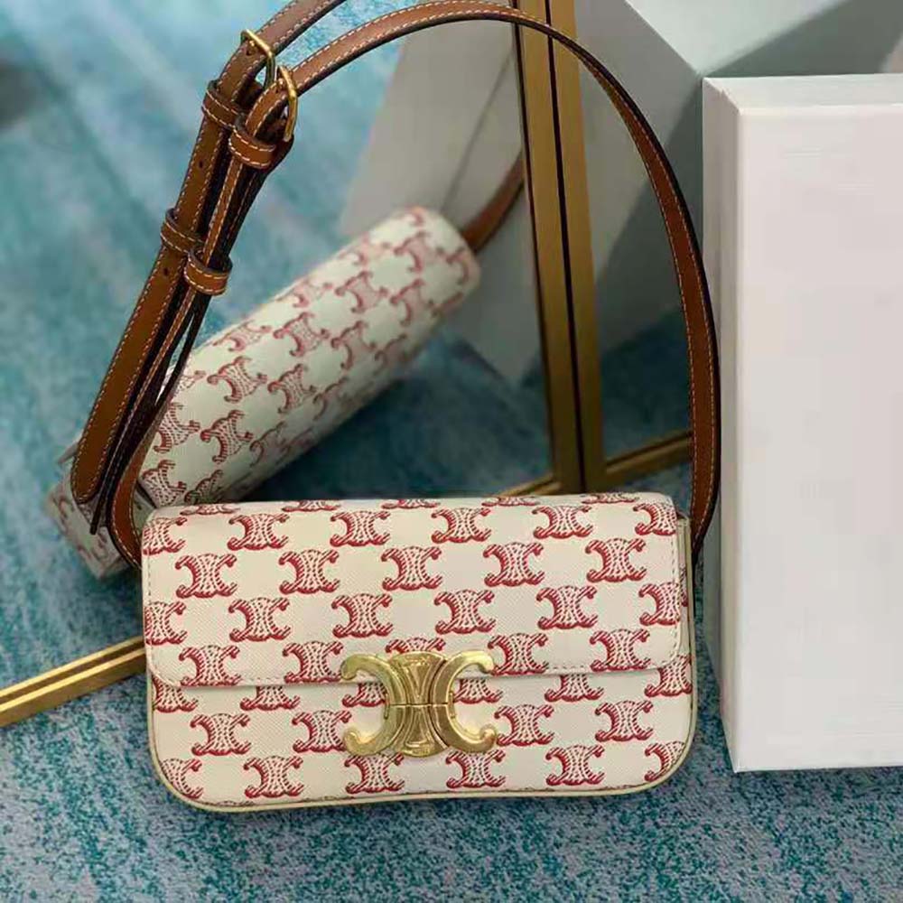 Close-up of red calfskin and antique gold Triomphe hardware detail