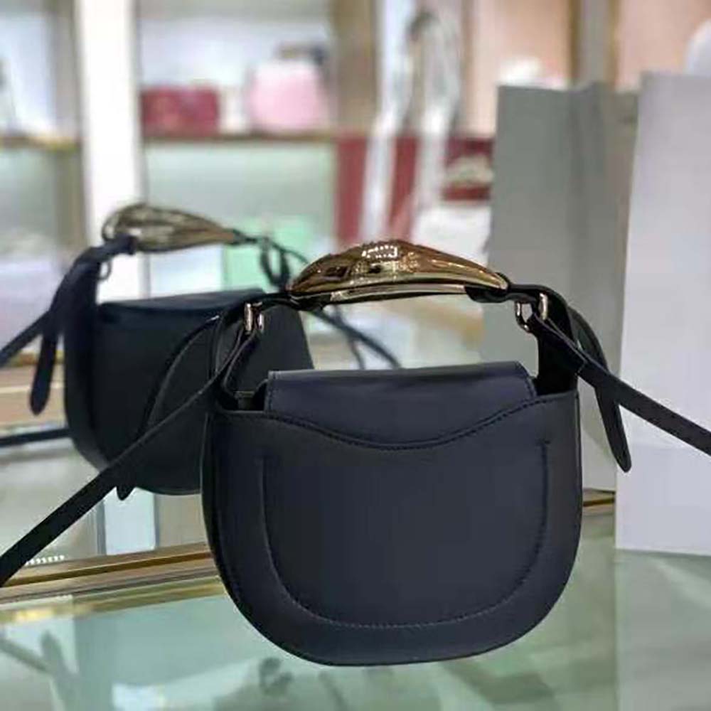 Side profile showing compact silhouette of Chloe Women Kiss Small Purse
