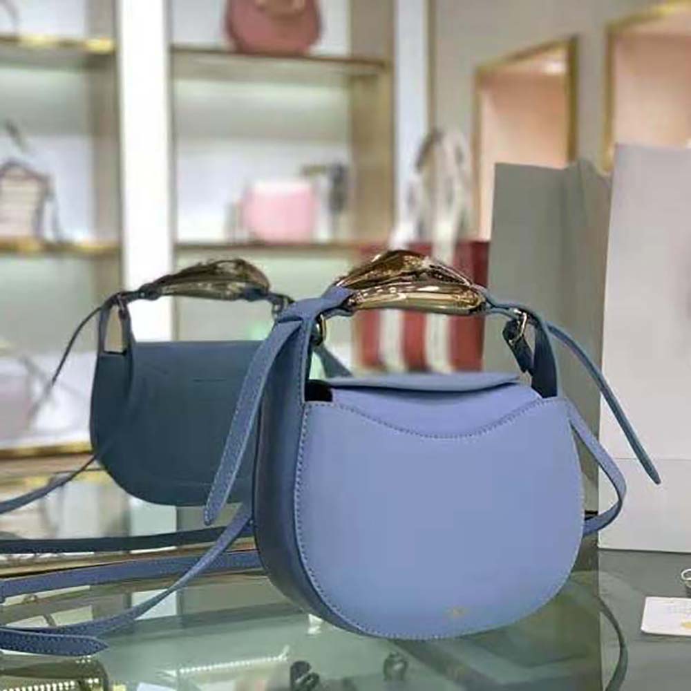 Side angle showing compact silhouette of Chloe Women Kiss Small Purse