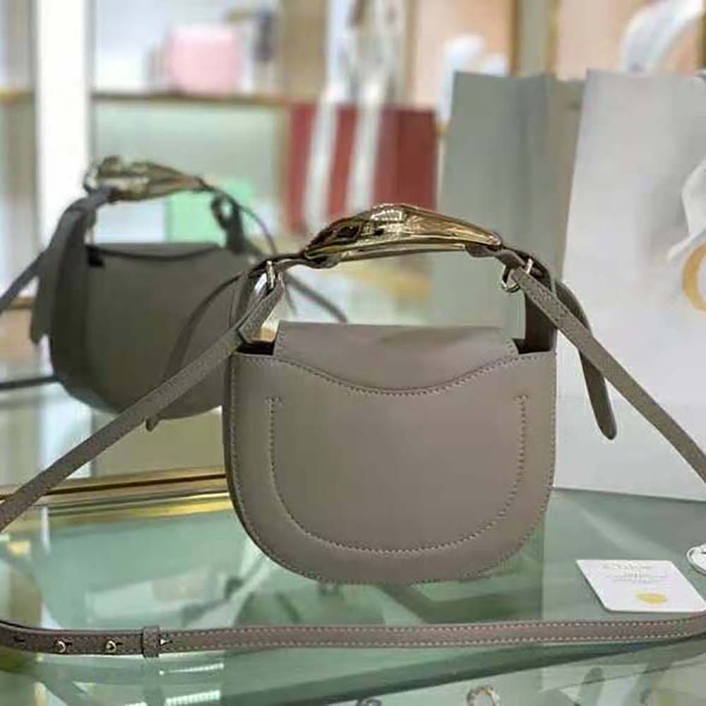 Side profile showing silhouette and texture of Chloe Women Kiss Small Purse