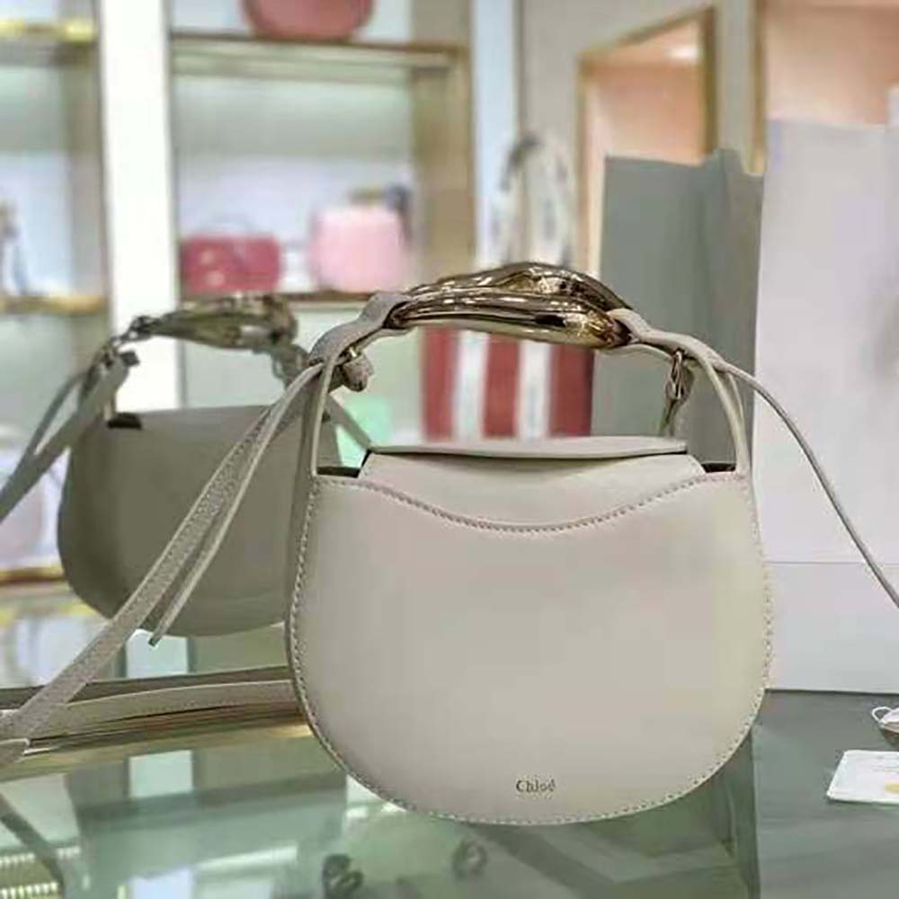 Close-up of gold-tone hardware detail on Chloe Women Kiss Small Purse