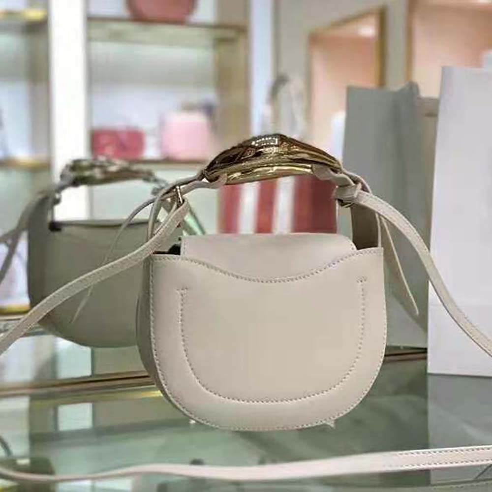 Side angle showing slim profile of Chloe Women Kiss Small Purse