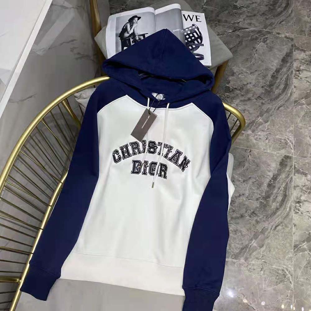 Side angle showing relaxed fit and hood of Dior Men Dior and Kenny Scharf sweatshirt