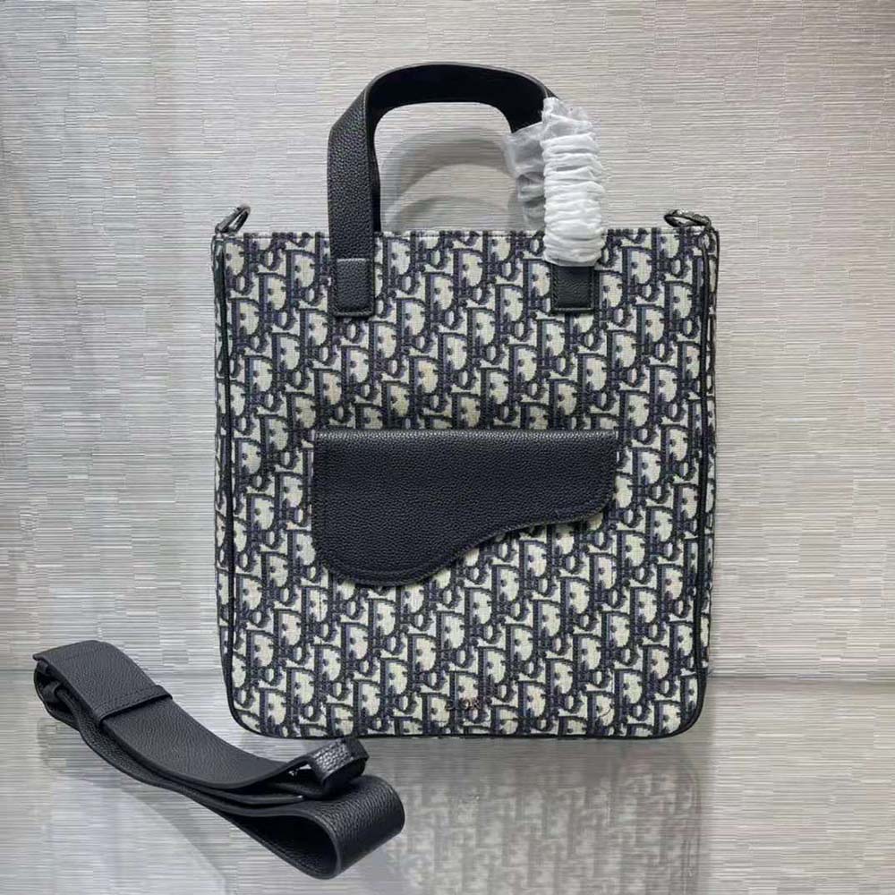 Close-up detail of Dior Oblique jacquard fabric on Dior Men Saddle Tote Bag
