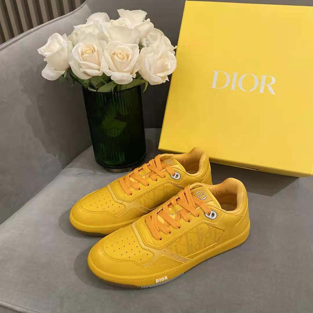 Close-up of yellow calfskin leather and Dior embossed sole detail