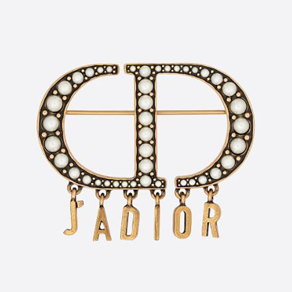 Close-up of Dior Women 30 Montaigne Brooch with antique gold finish and pearls