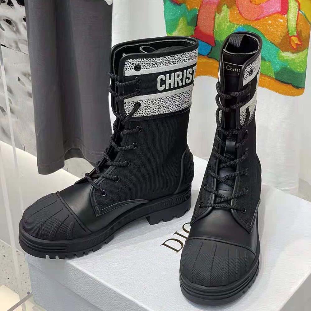 Close-up on black calfskin and technical fabric texture of Dior Women D-major Ankle Boot