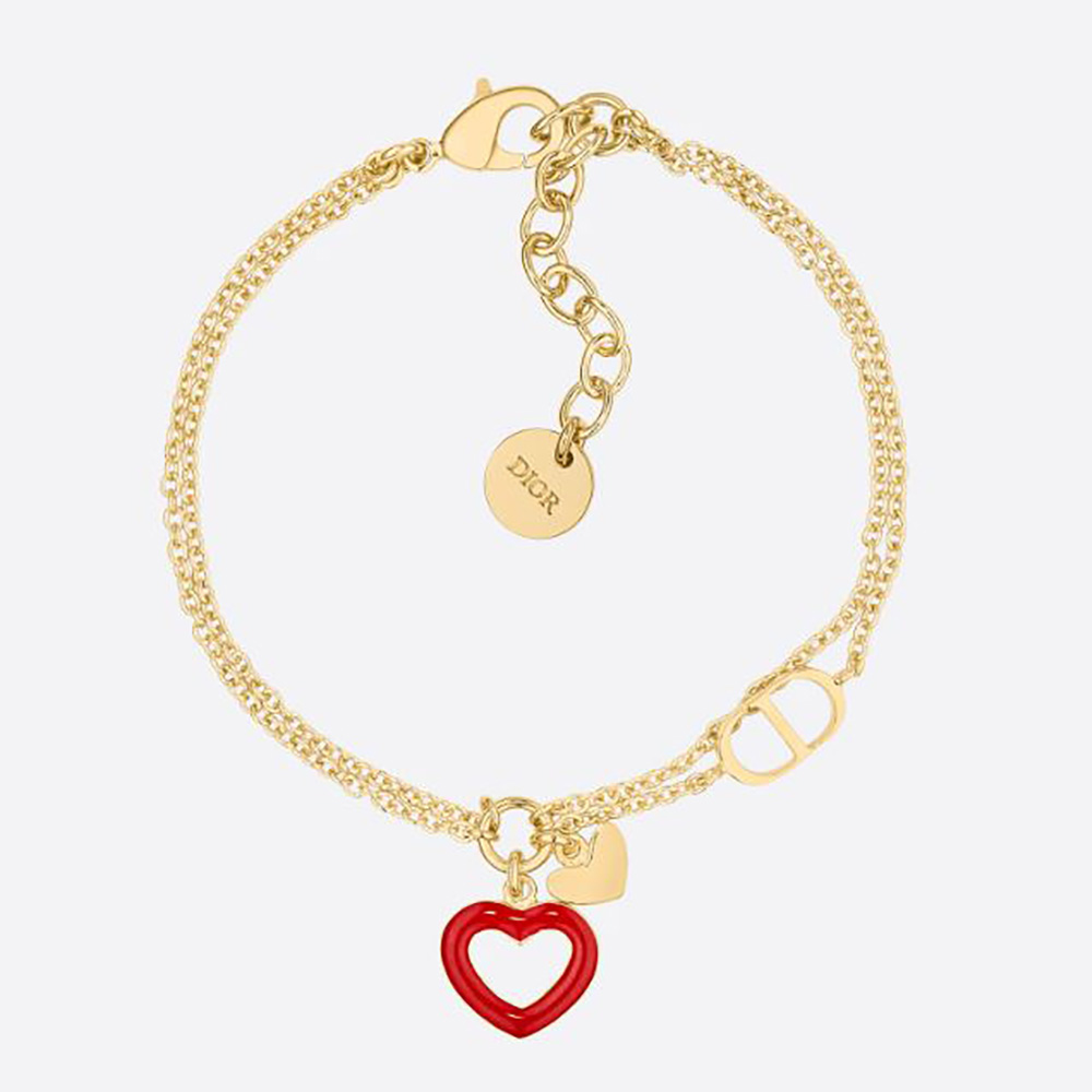 Close-up of Dior Women Dioramour Bracelet gold-finish metal and red lacquer detail