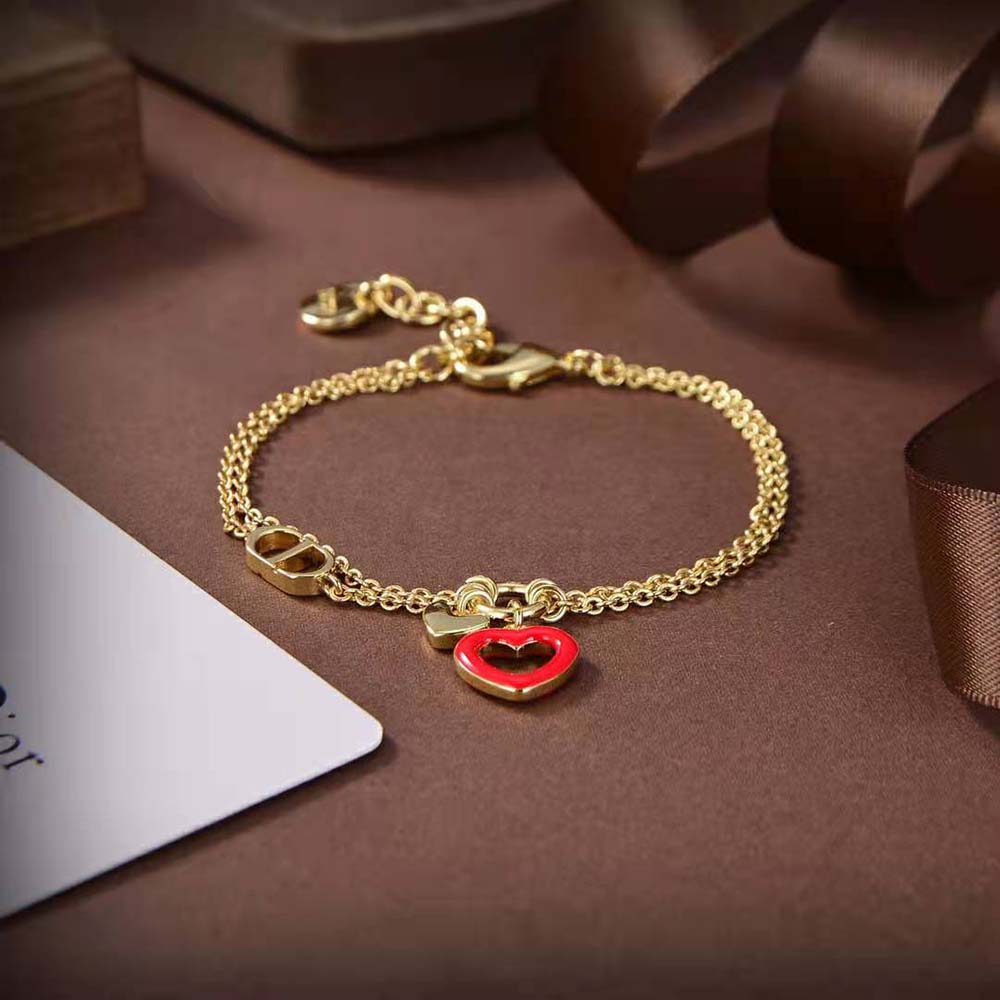Dior Women Dioramour Bracelet styled on wrist with gold and red lacquer accents