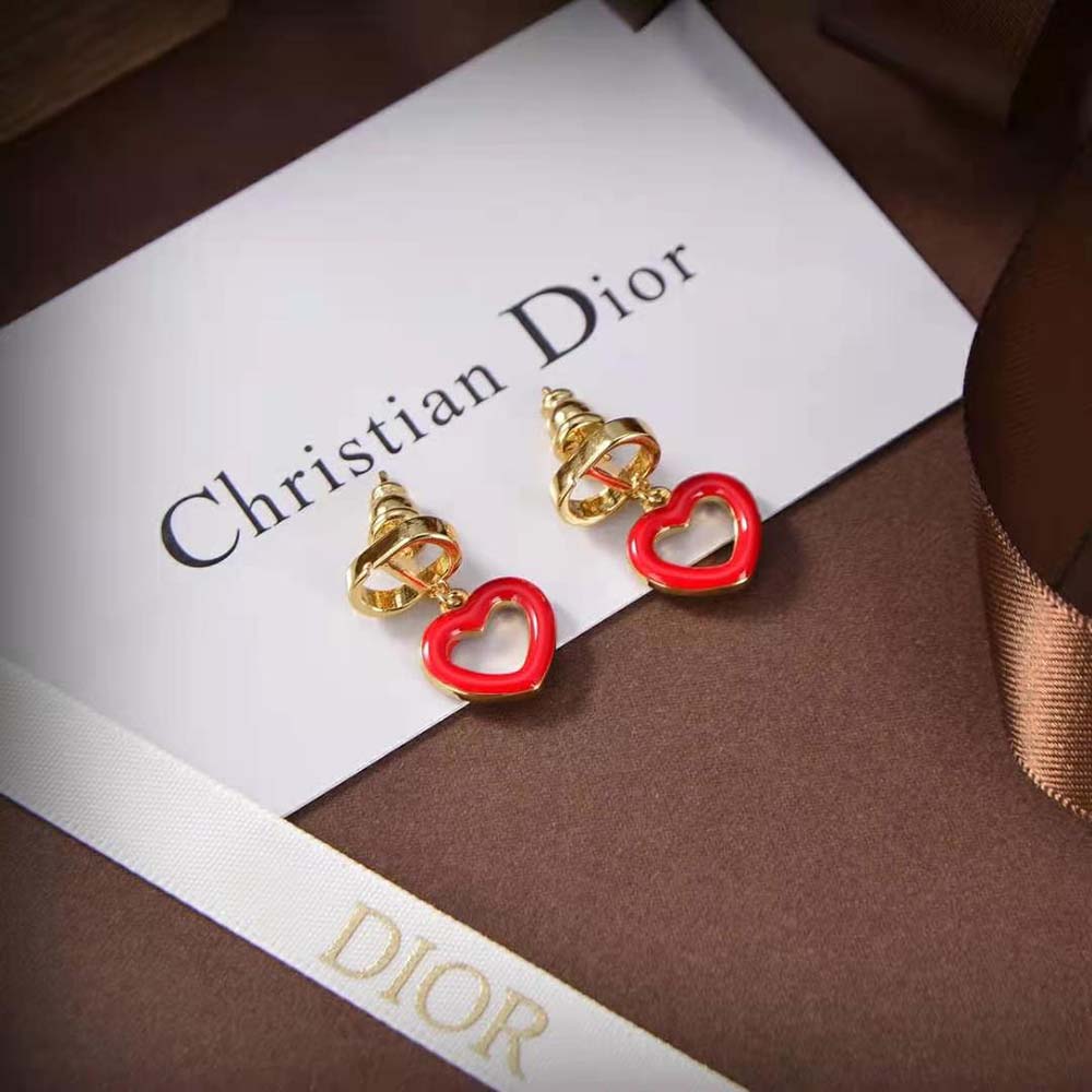 Close-up of gold-finish metal and Dior logo on Dioramour Earrings