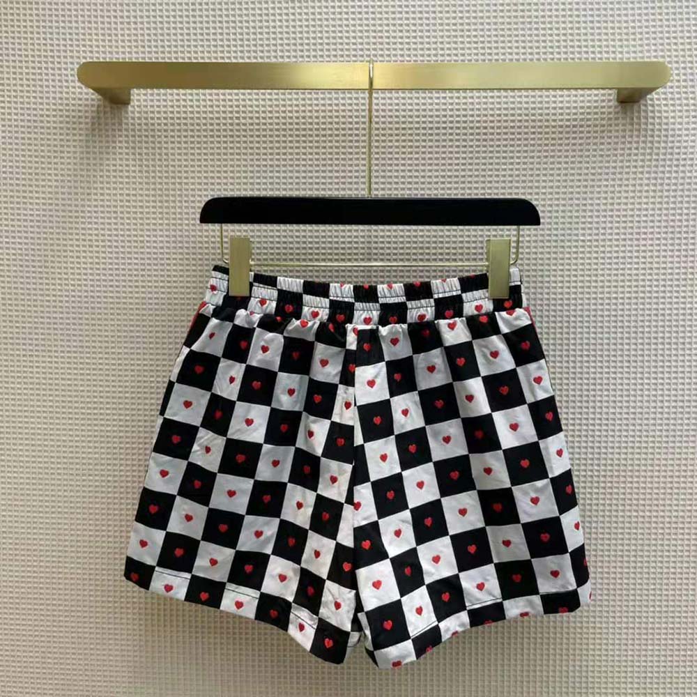 Side angle of black Dior Women Dioramour Shorts showing silhouette