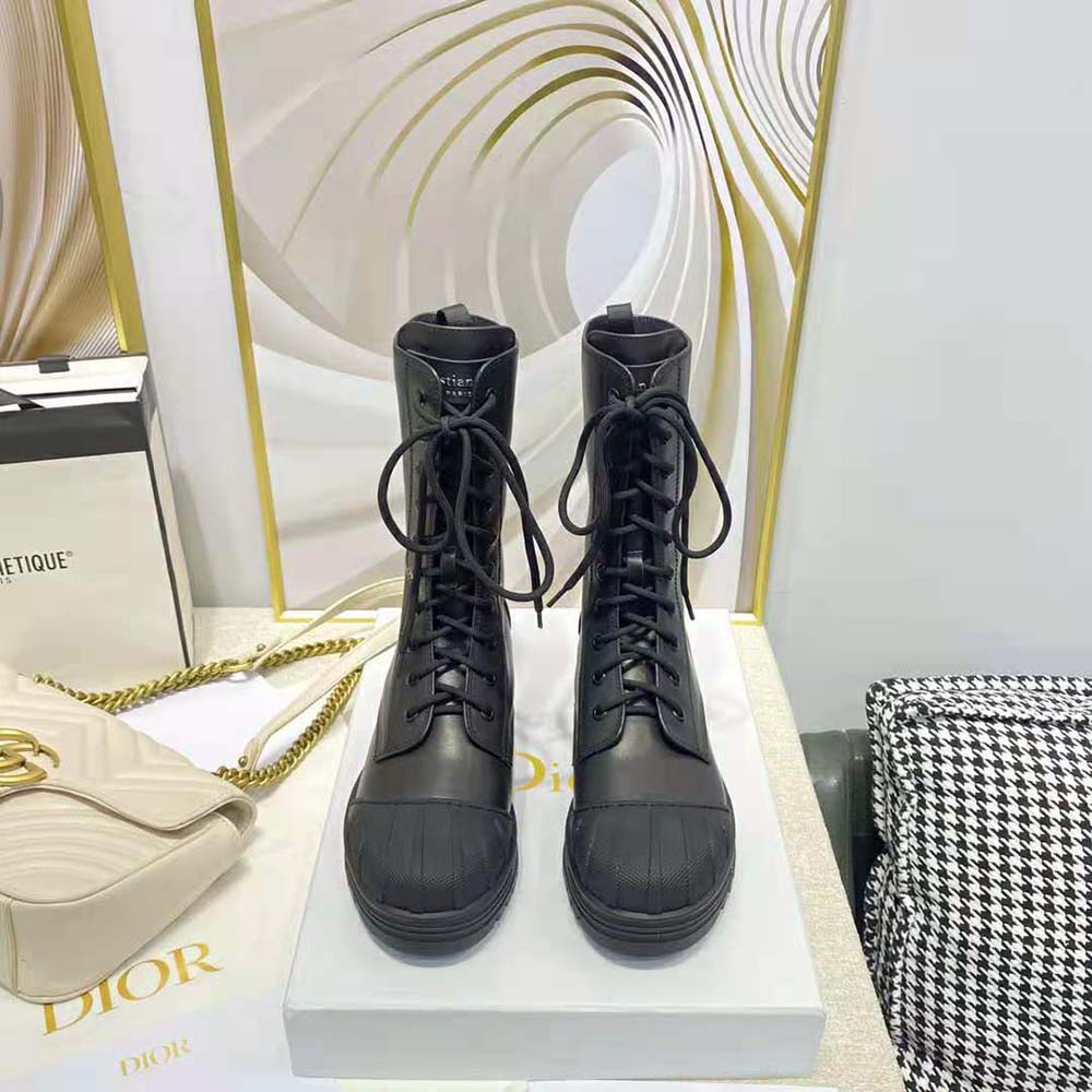 Close-up of DiorIron hardware detail on black ankle boot