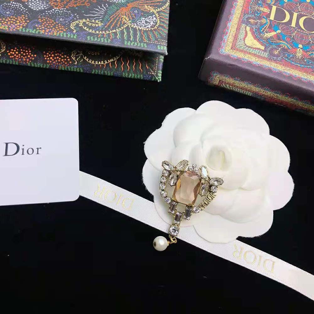 Side angle showing antique gold-finish metal clasp on Dior Women J adior Brooch