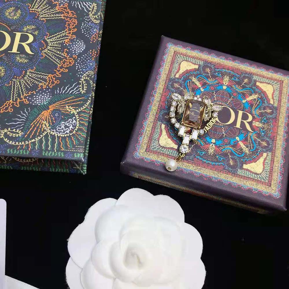 Close-up of white resin pearl detail on Dior Women J adior Brooch