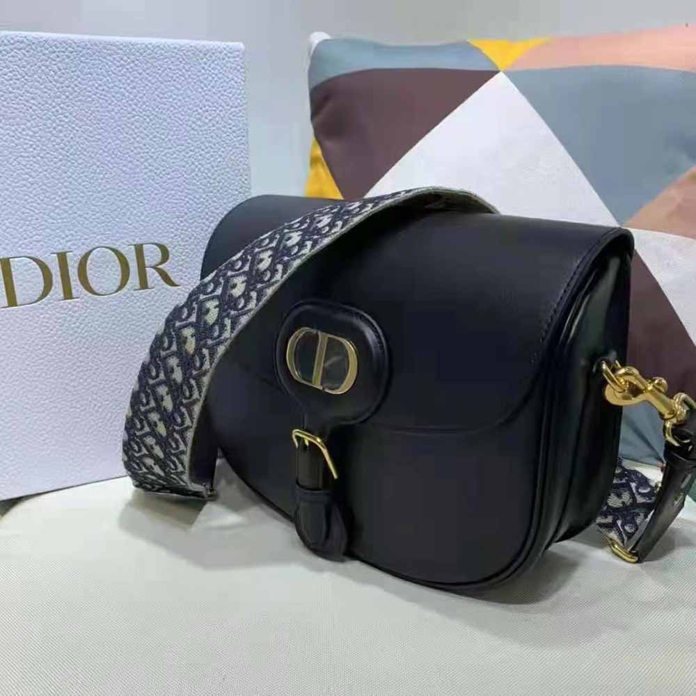 Side angle showing structured silhouette of Dior Women Large Dior Bobby Bag
