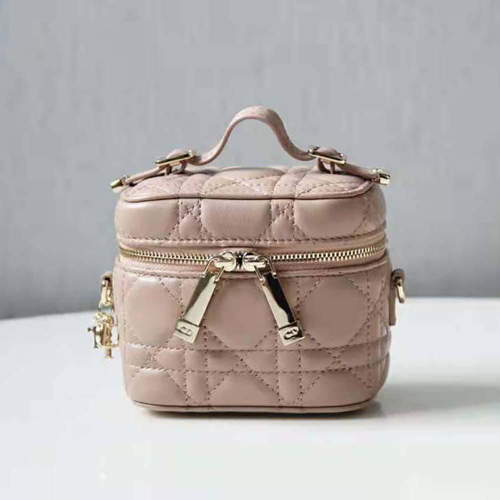 Close-up of Cannage stitching and Dior charm on Micro Lady Dior Vanity Case