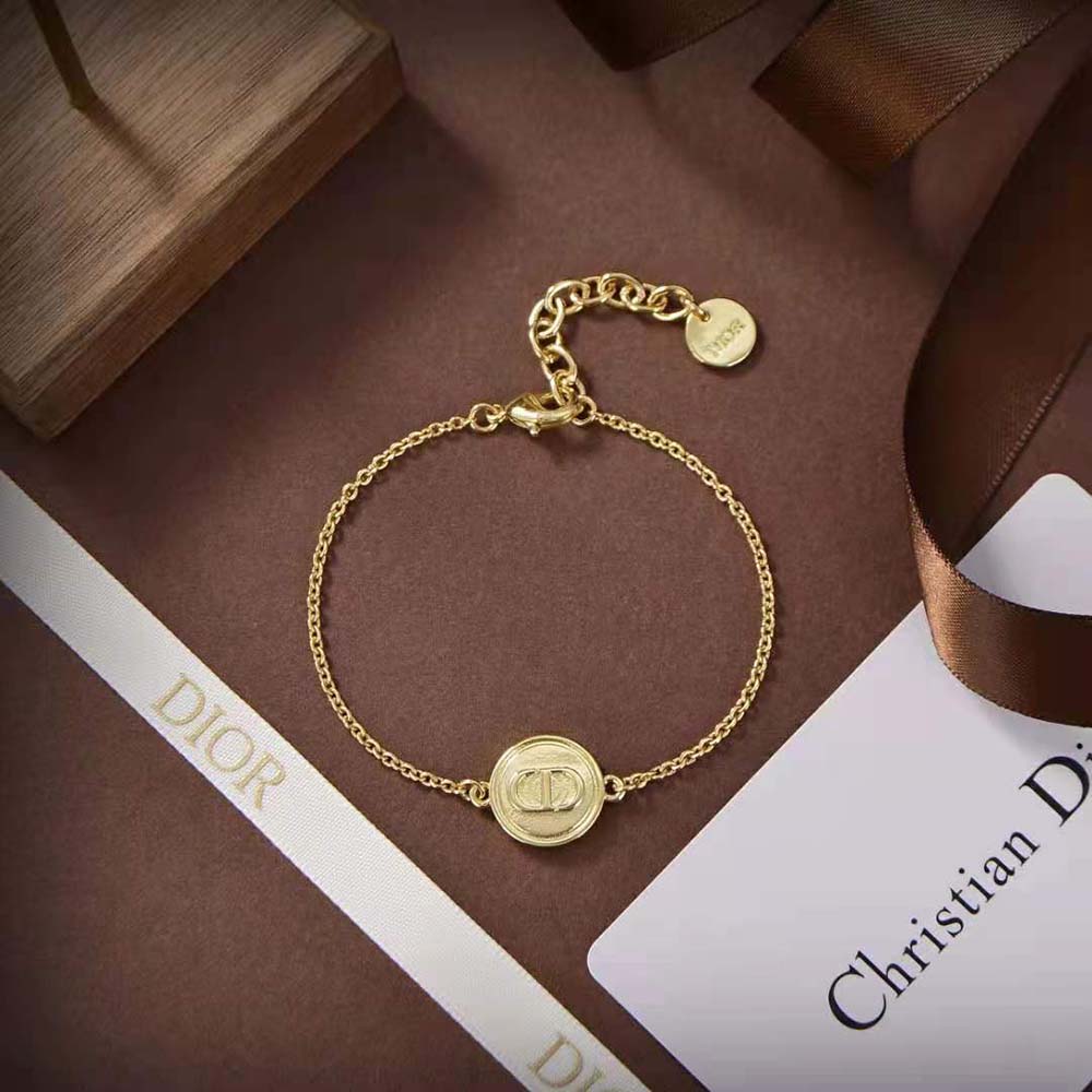 Dior Women Petit CD Bracelet gold-finish metal shimmering on wrist