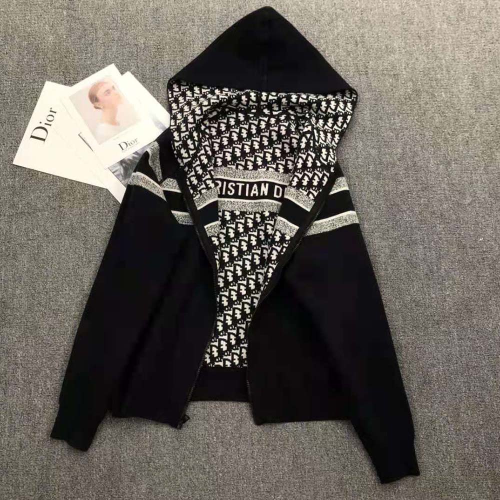 Close-up detail of Dior Oblique hardware on reversible cardigan
