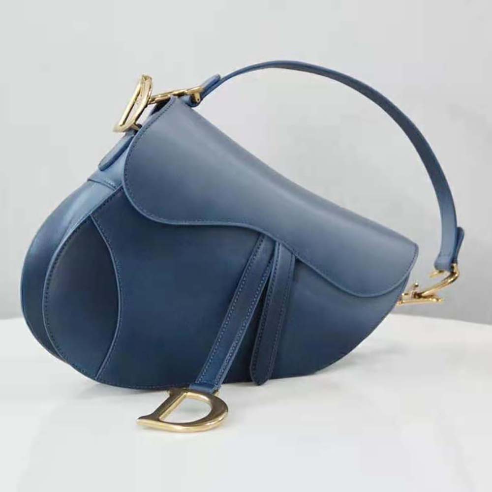 Side silhouette showcasing the gradient indigo blue on Dior Women Saddle Bag