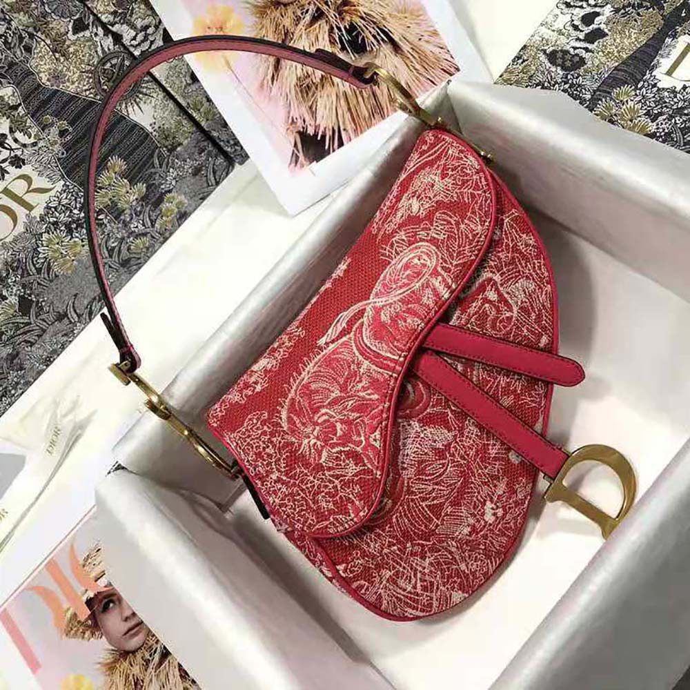 Close-up of red jacquard fabric and antique gold hardware detail