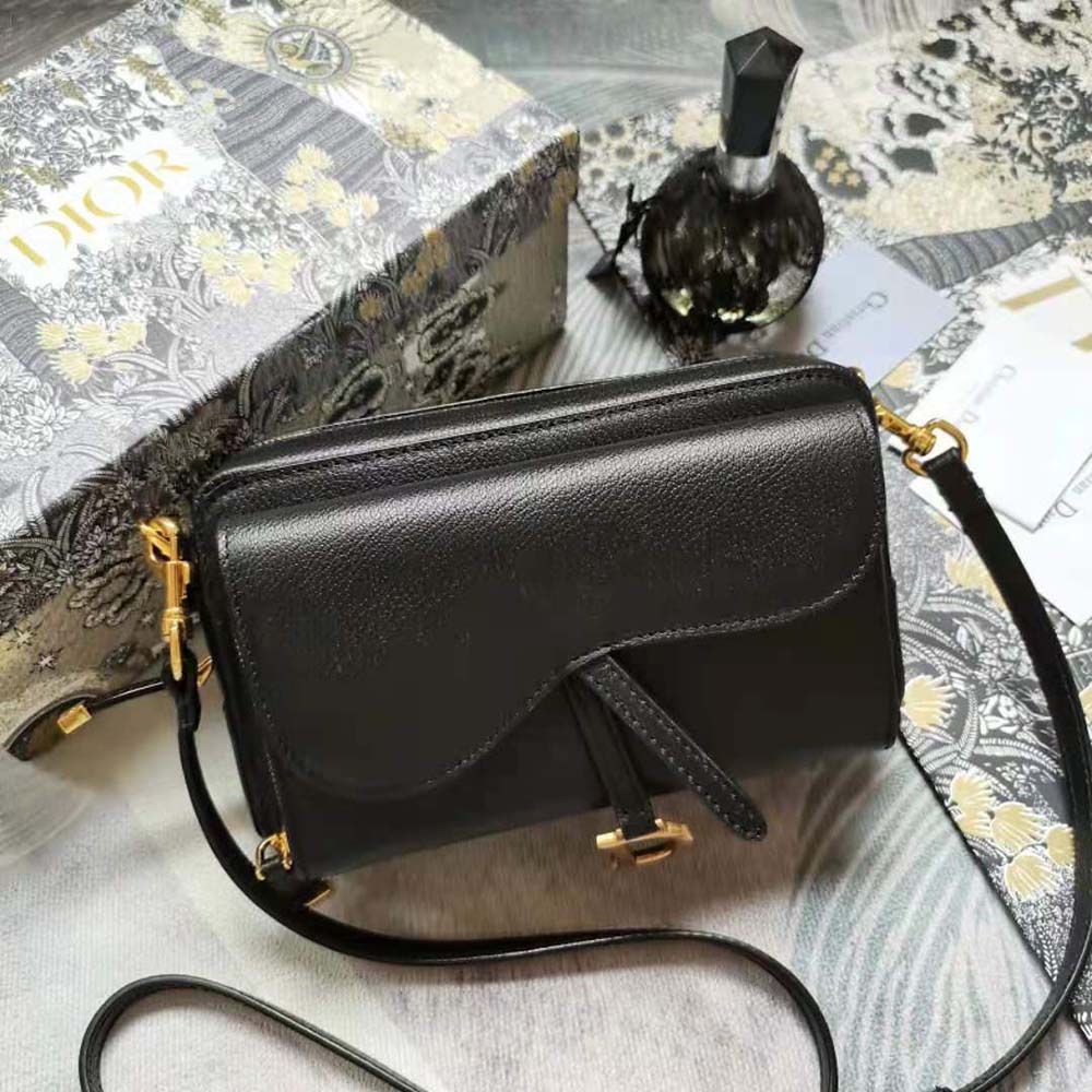 Close-up on gold-tone hardware and goatskin texture of Dior Women Saddle Double Pouch