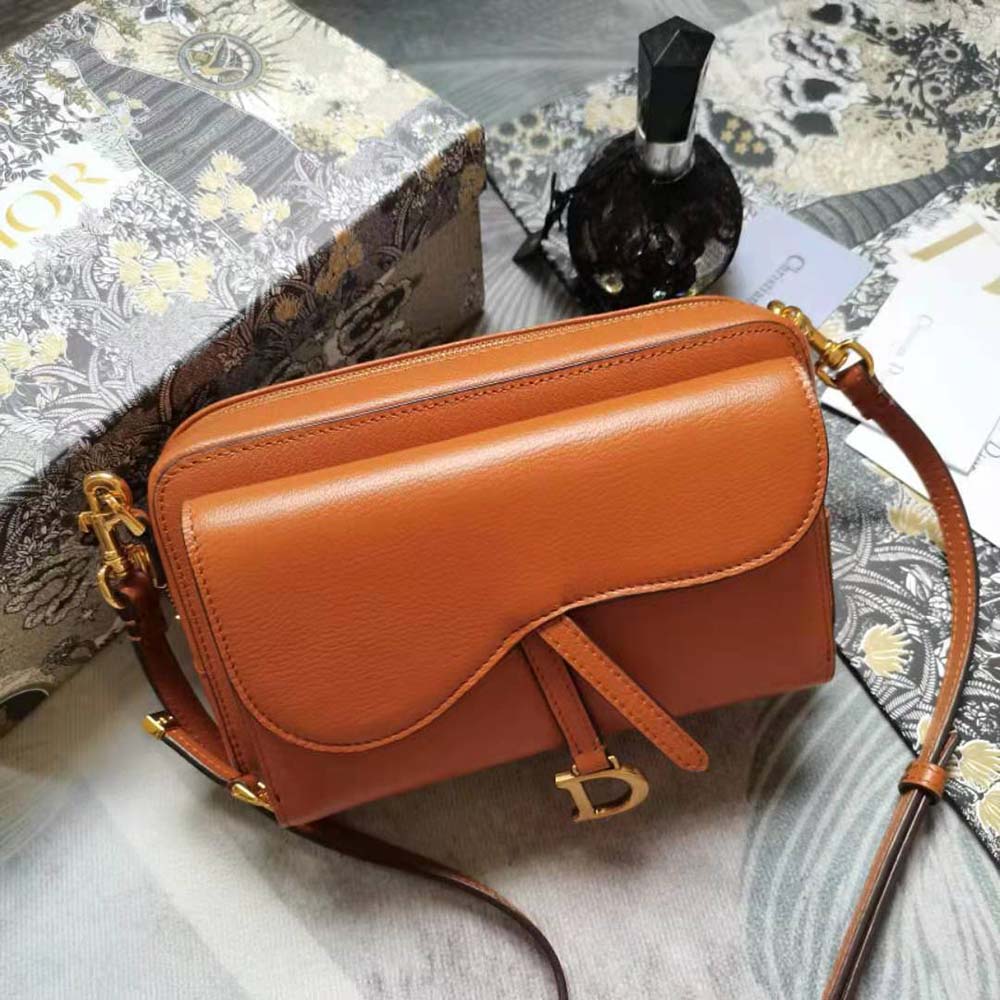 Close-up of polished gold hardware on Dior Women Saddle Double Pouch